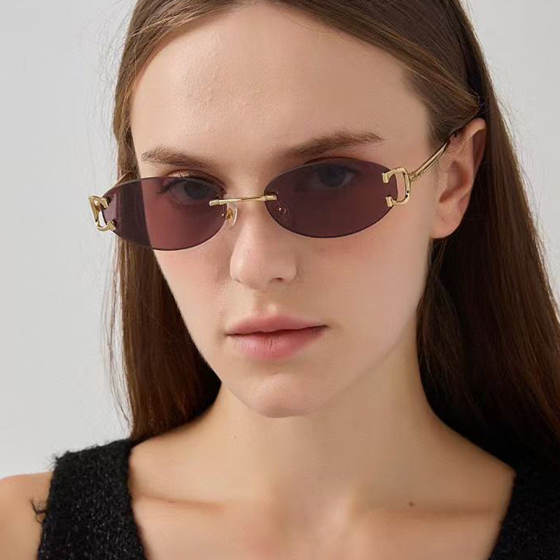 Damen elegante ovalförmige Sonnenbrille mit modischem Metallrahmen Karnz