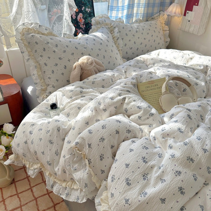 Blumenverziertes Steppbett-Set