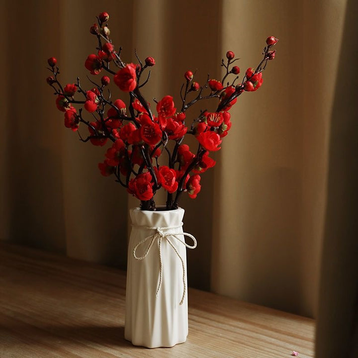 Dekorative Blumenäste Arrangement