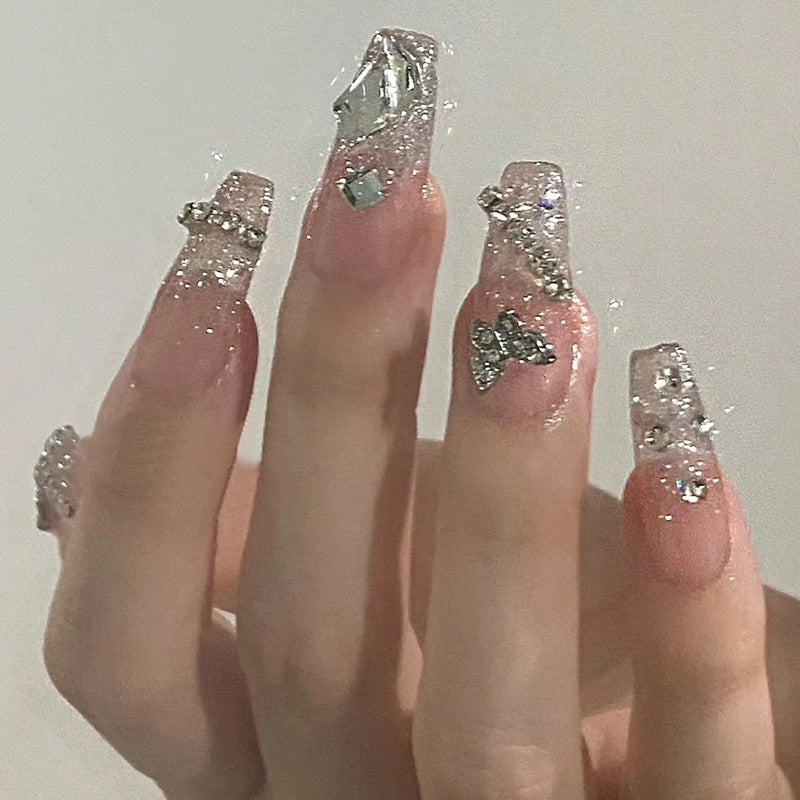 Glamouröse Kunstfingernägel mit Zarten Blüten- und Glitzereffekten Karnz