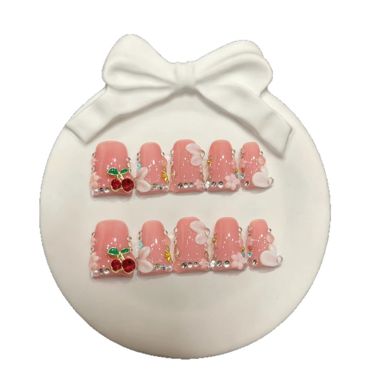 Dekorative Press-On Nail Art Set mit floralen und Kirschakzenten