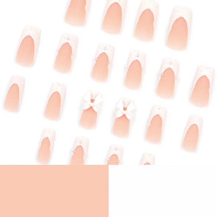 Künstliche Nagelkunst mit Schleifendekor Karnz