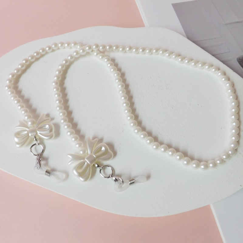 Elegante Perlen-Brillenkette mit Schleifenanhängern Karnz