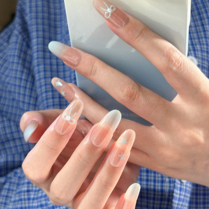 Glamouröse Ombre Press-On Nagelset mit dekorativen Stern- und Schleifenakzenten Karnz