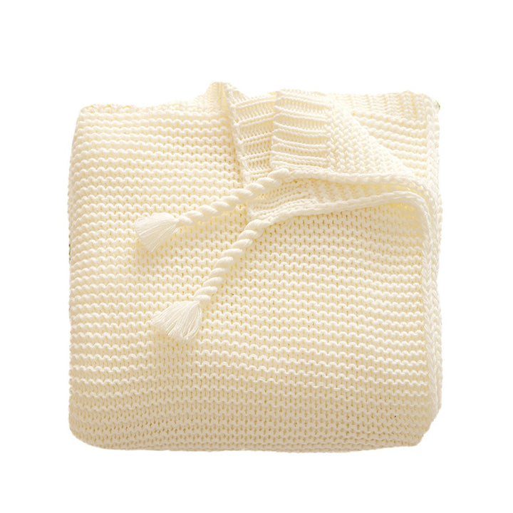 Grobgestrickte Kuscheldecke mit Rautenmuster und bunten Knötchen