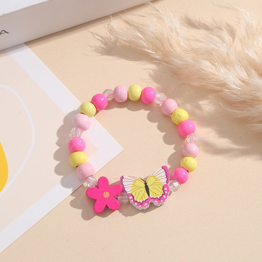 Verspieltes Armband mit Herz- und Schmetterlings-Anhängern Karnz