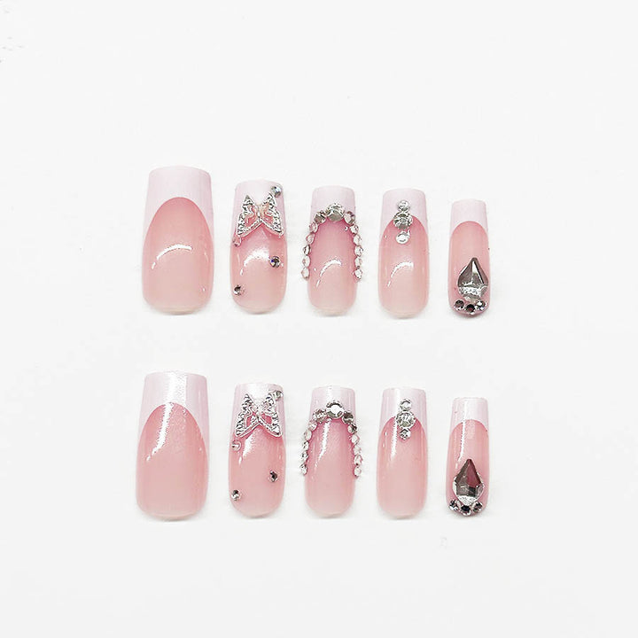 Kunstnagelset mit eleganten Strass- und Glitzerverzierungen Karnz