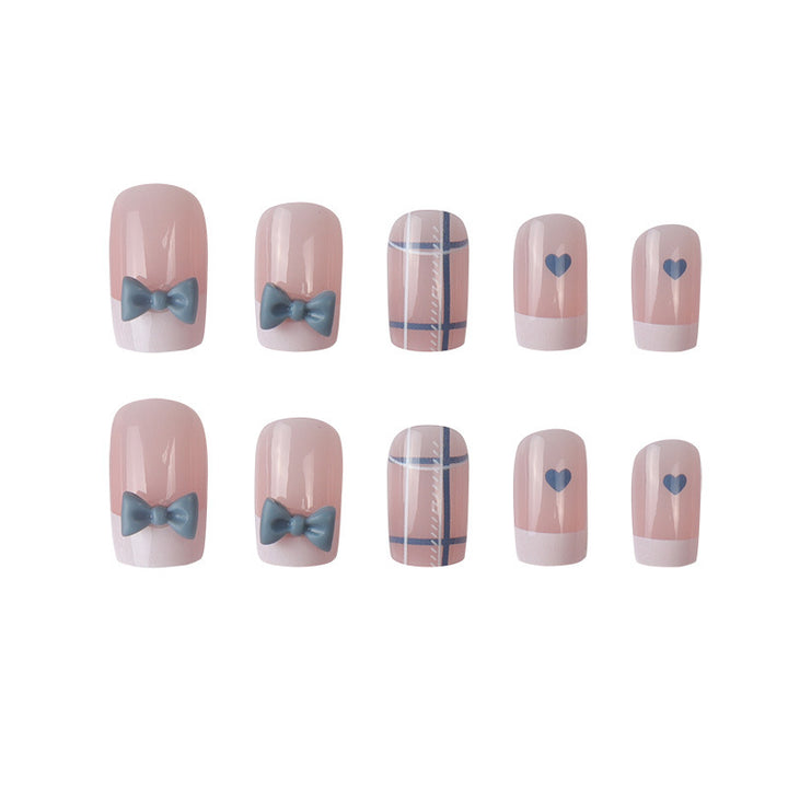 Dekoratives Press-On Nagelkunst-Set mit Schleifen- und Herzdesign Karnz