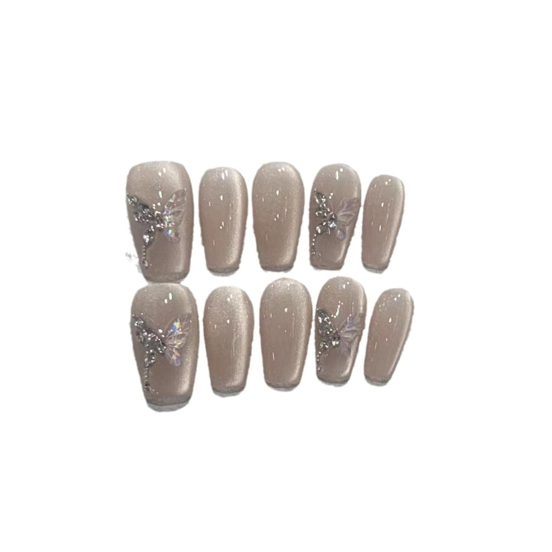 Stilvolles Press-On Nagelkunst-Set mit eleganten Schmetterlings- und Juwelenelementen Karnz