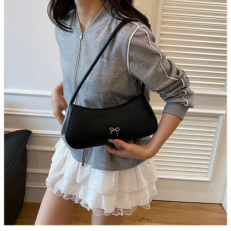Elegante geschwungene Handtasche Karnz