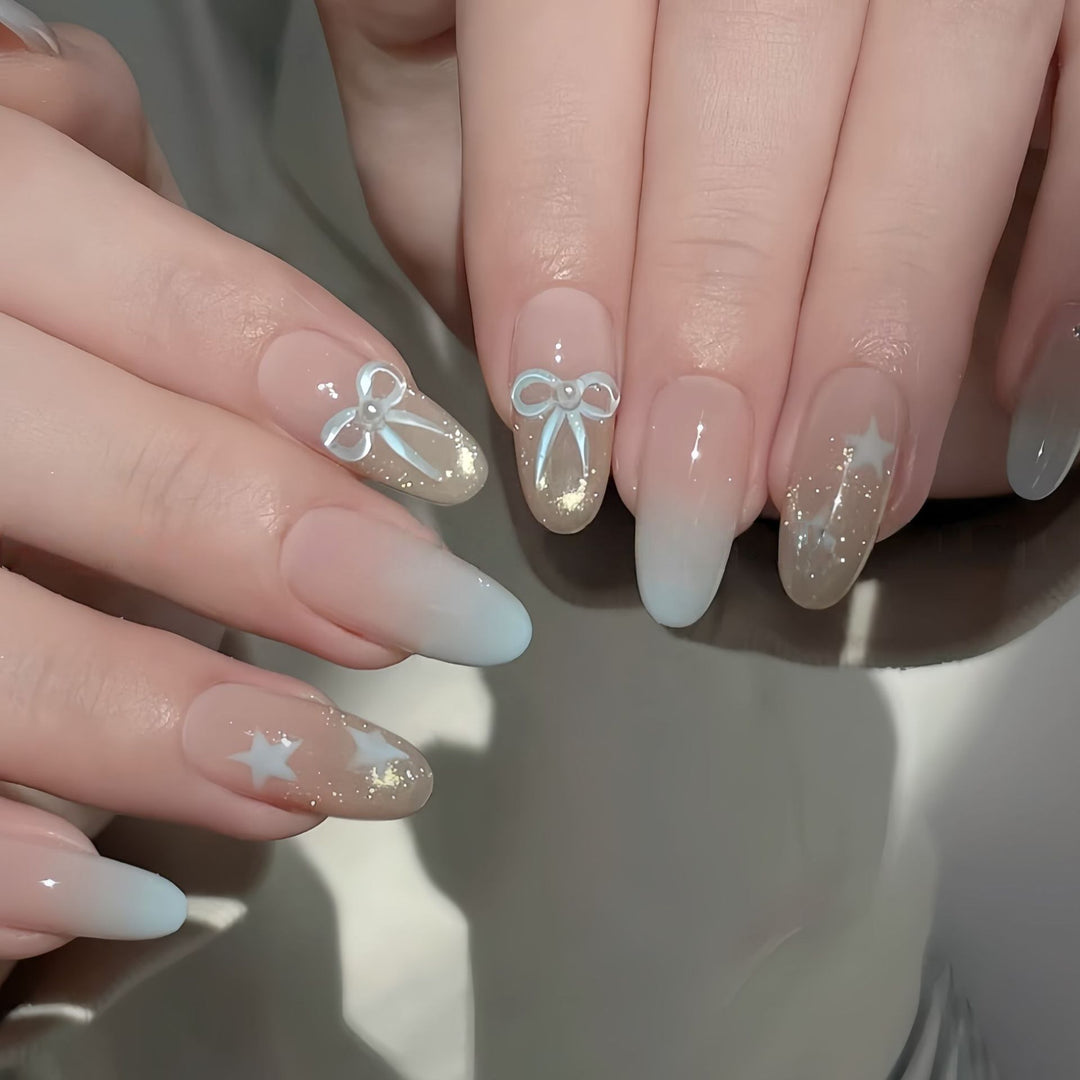 Elegante Kunstnagelset mit Schleifen- und Sternendesigns Karnz