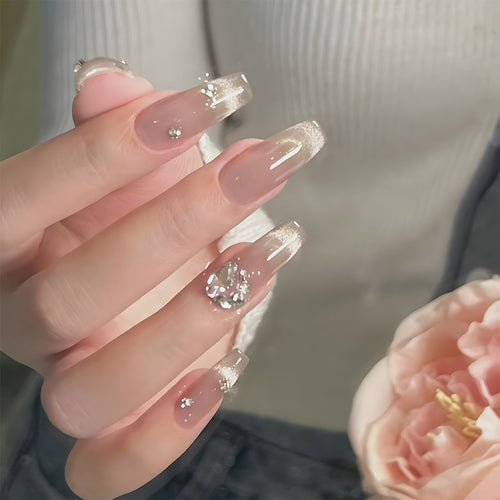 Dekoratives Press-On Nagelkunstset mit eleganten Strasssteinen Karnz