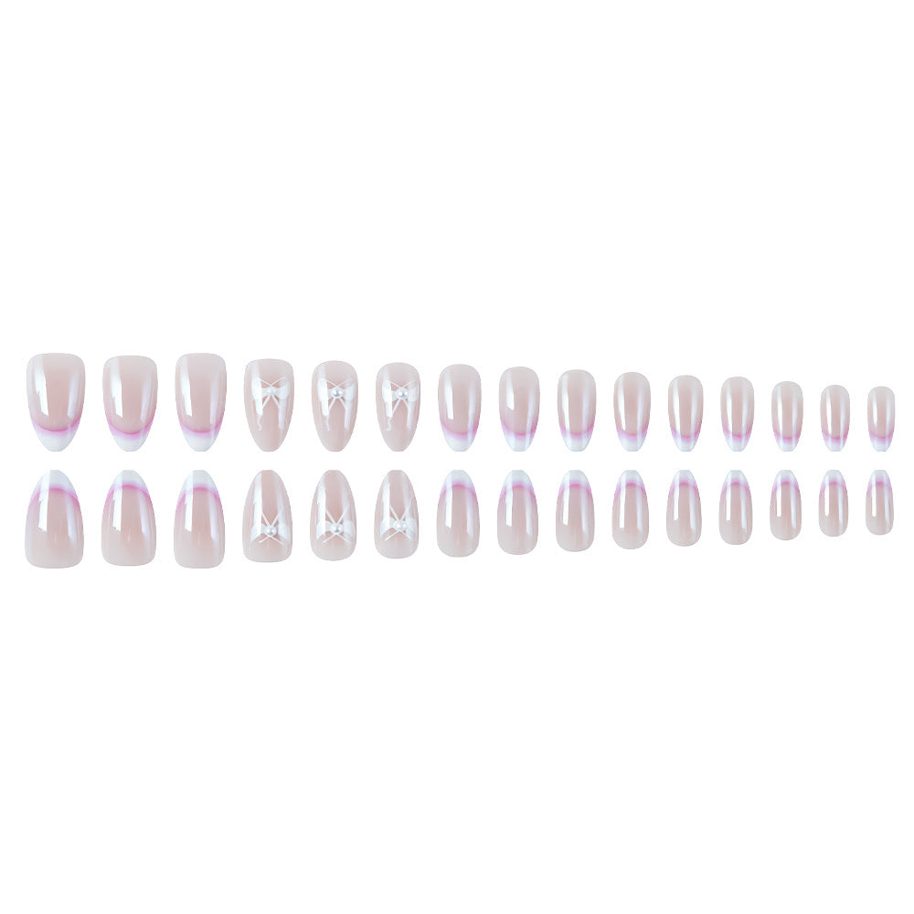 Elegante French Tip Press-On Nägel mit Schleifenakzenten Karnz