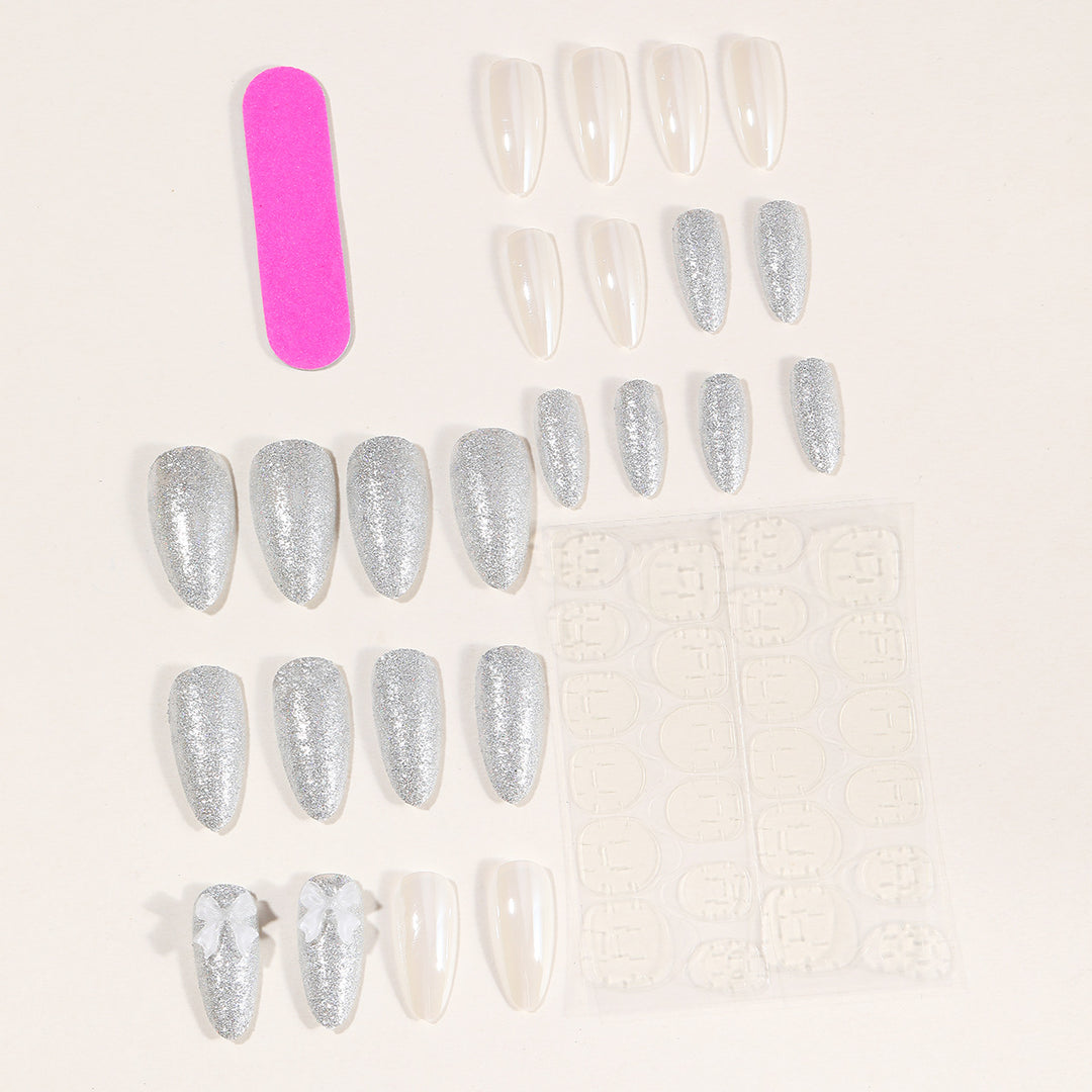 Elegante Stiletto-Nagelkunstverlängerungen mit 3D-Schleifenakzenten Karnz