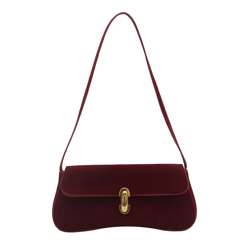 Elegante Wildleder-Handtasche mit verspieltem Schlüsselanhänger