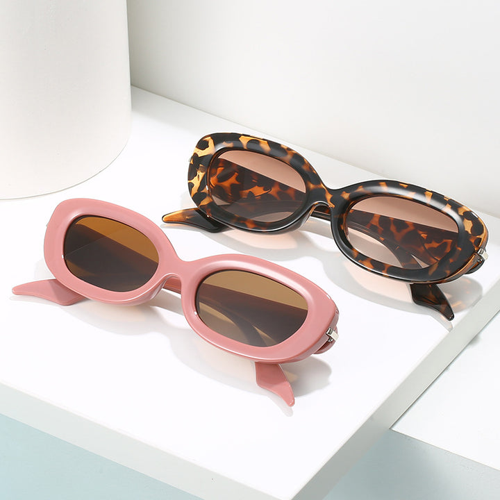 Damen modische Sonnenbrille mit stilvollem, geschwungenem Rahmen Karnz