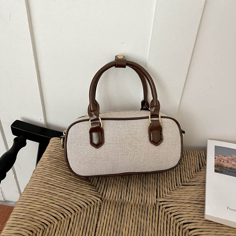 Vintage-inspirierte glänzende Handtasche