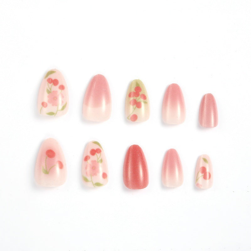 Kreatives Kunstnagelset mit Kirsch-Design Karnz