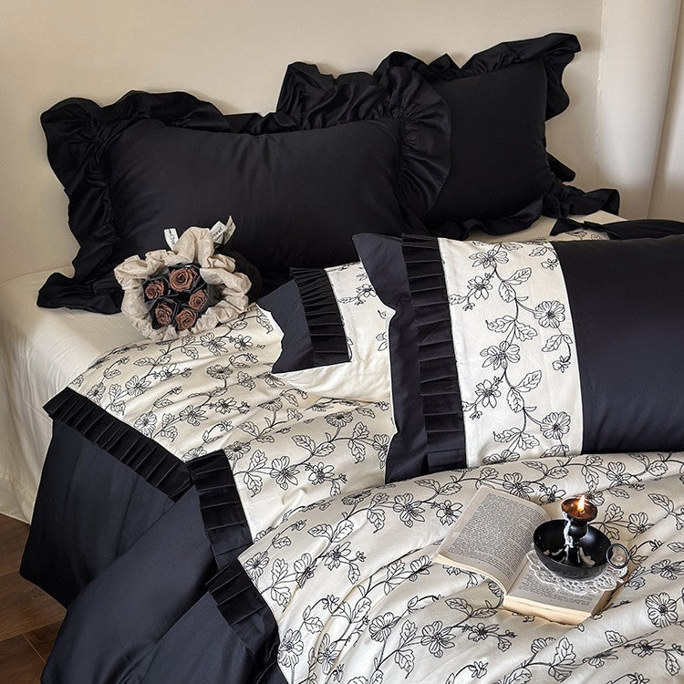 Elegante Wendebettwäsche-Garnitur aus feinem Satin mit botanischem Konturprint und Plissee-Bordüre
