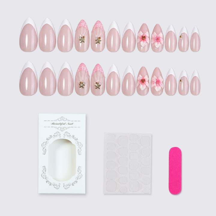 Kunstnagelset mit zarten Blüten- und Glitzerapplikationen Karnz