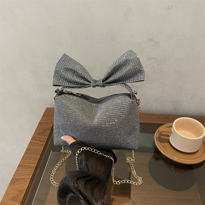Bogen-accentuierte funkelnde Handtasche