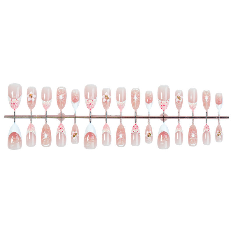 Kunstnagelset mit floralen und eleganten Designs Karnz