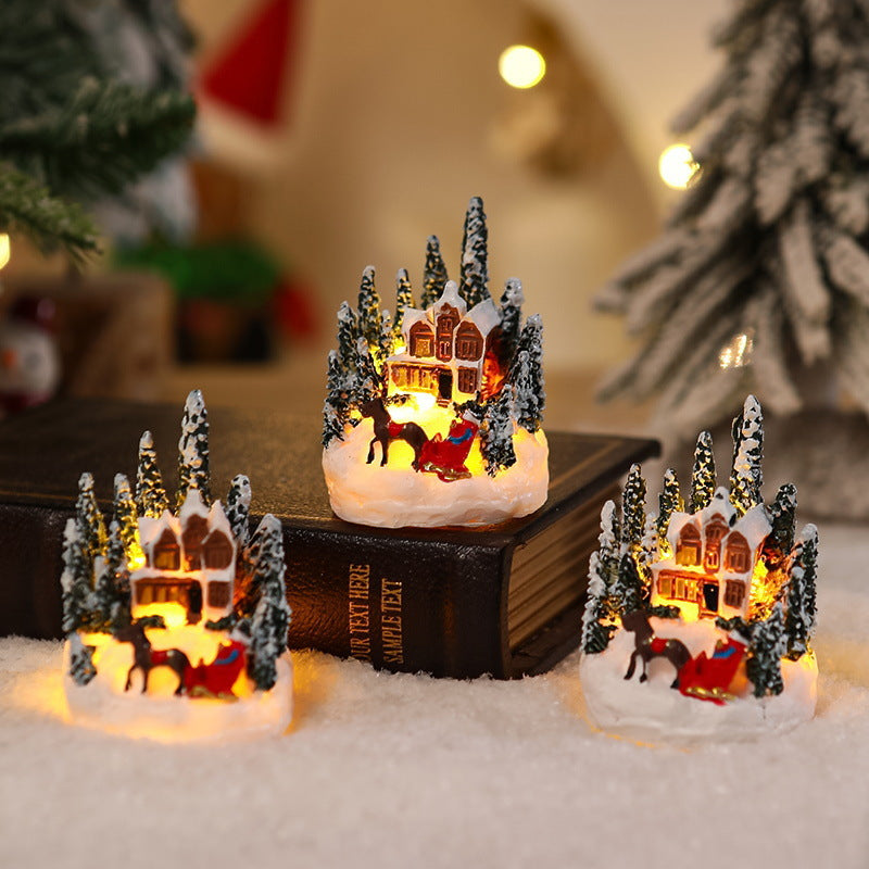 Beleuchtete Weihnachtsdorf-Szene Karnz