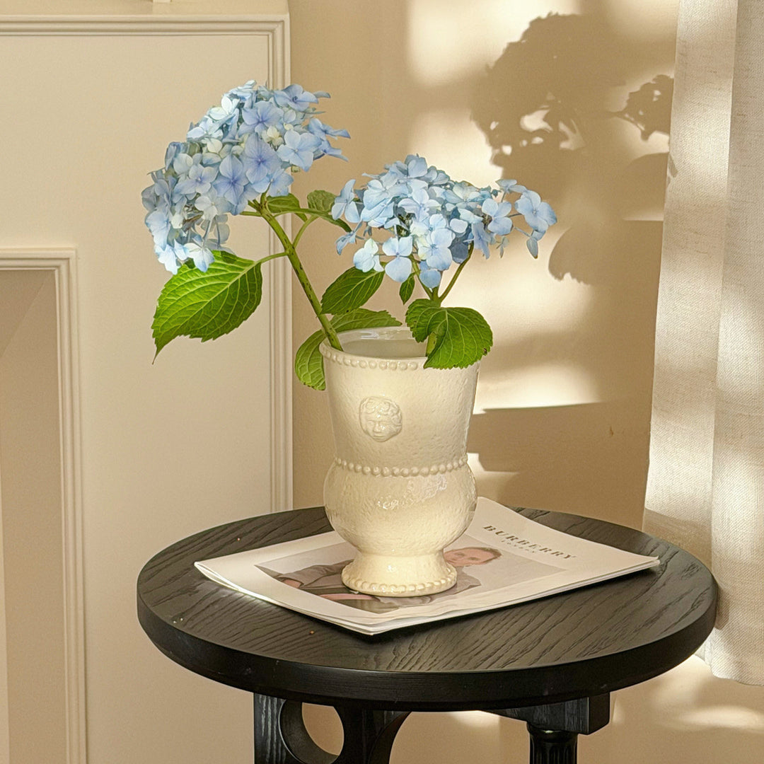 Ornamental Ceramic Double-Bulb Pedestal Vase with Beaded Rim and Cherub Relief
