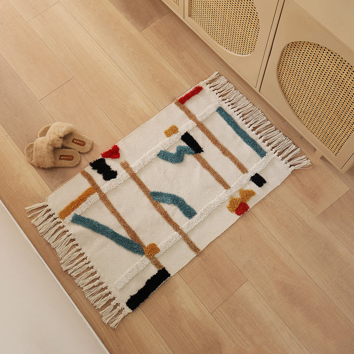 Gewebter Vorleger im Boho-Minimalstil mit kontrastiertem Tufting und Baumwollfransen Karnz