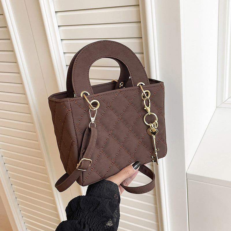 Luxuriöse Metallic Stepphandtasche