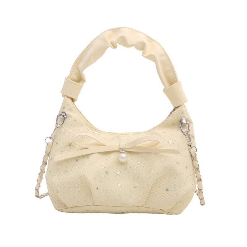Elegante Handtasche mit Schleifendetail und Sternenprint