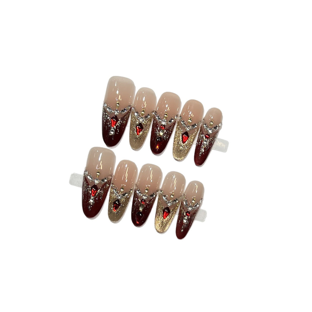 Dekoratives Stiletto Press-On Nagelset mit Edelsteinakzenten Karnz