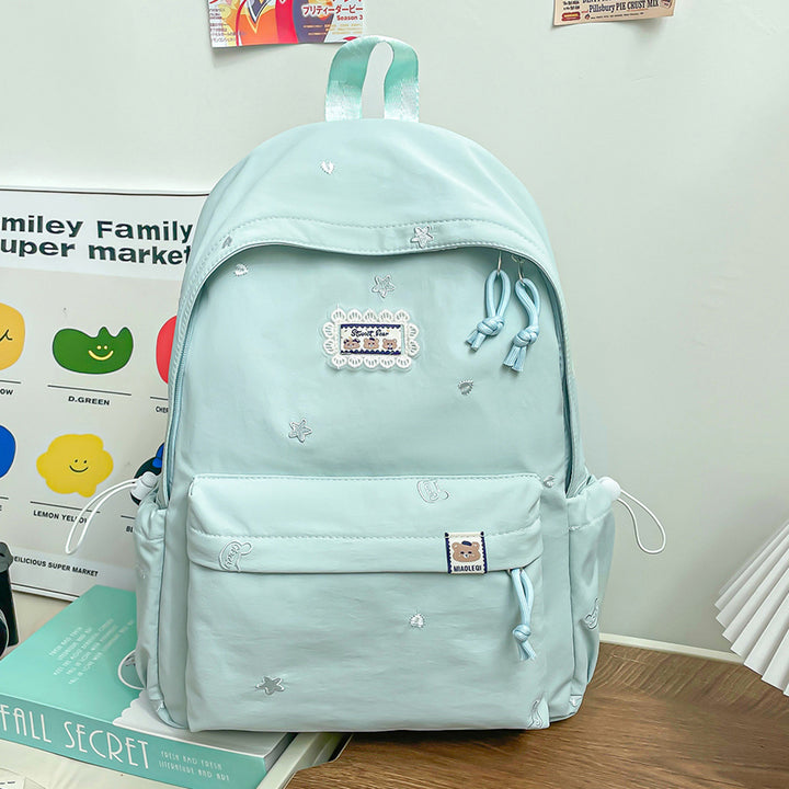 Stylischer backpack mit floralem Schmuck Karnz