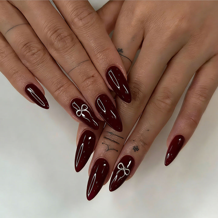 Elegante Stiletto Press-On Nägel mit Schleifen-Design
