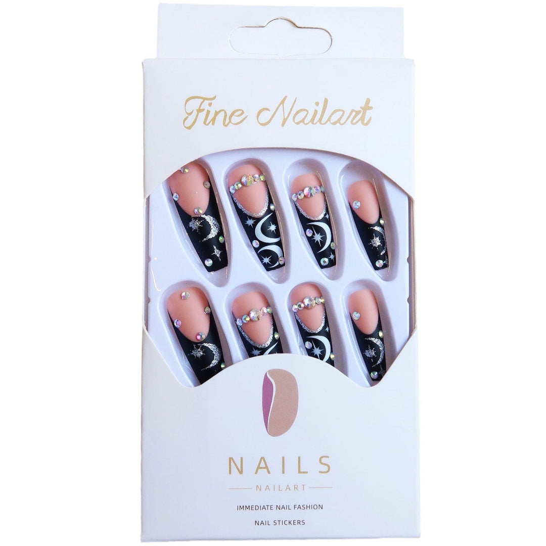 Künstlerisches langes Stiletto Press-On Nagelset mit Mond- und Sternmustern