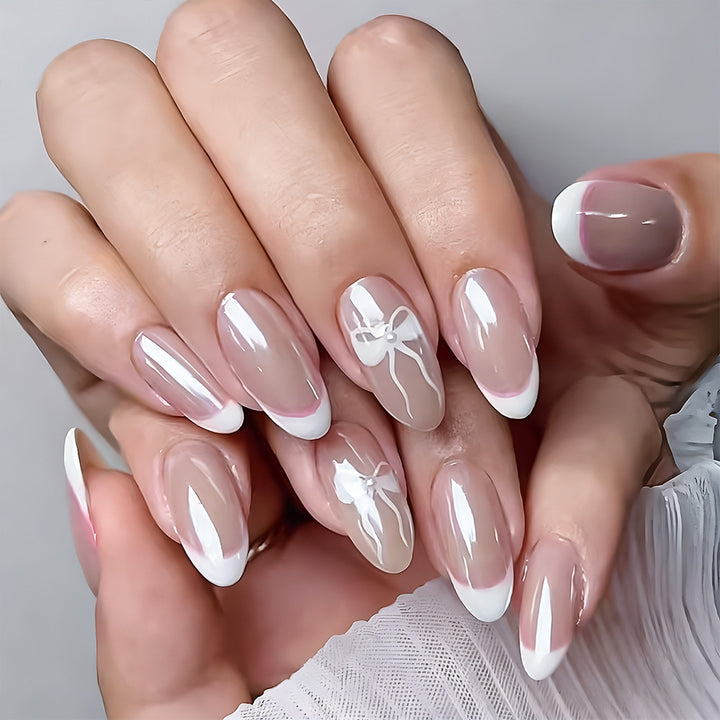 Elegante French Tip Press-On Nägel mit Schleifenakzenten Karnz