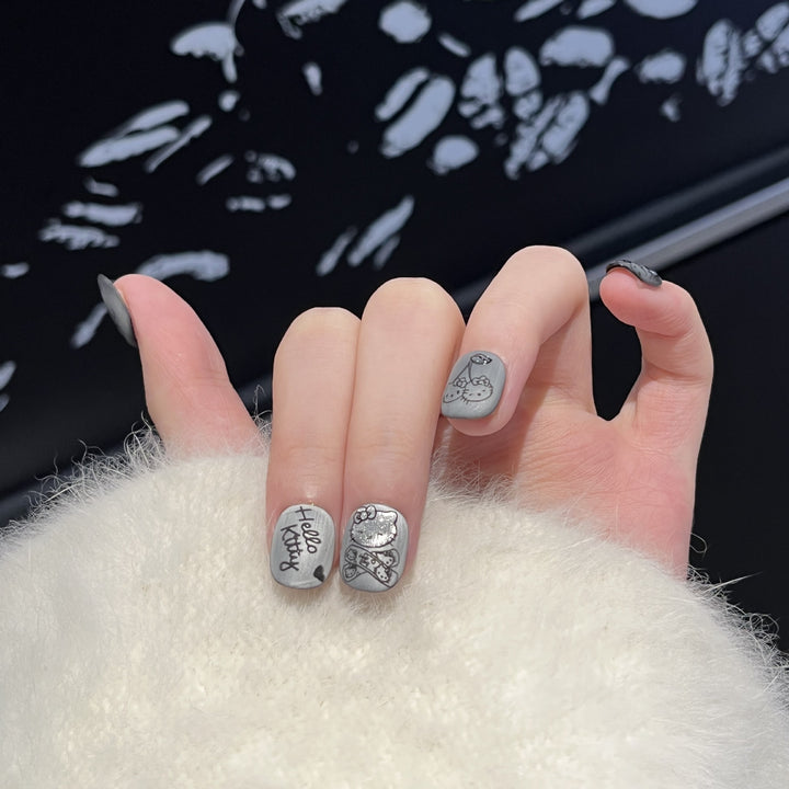 Künstlerisches Press-On Nagelset mit verspielten Charakterdesigns Karnz