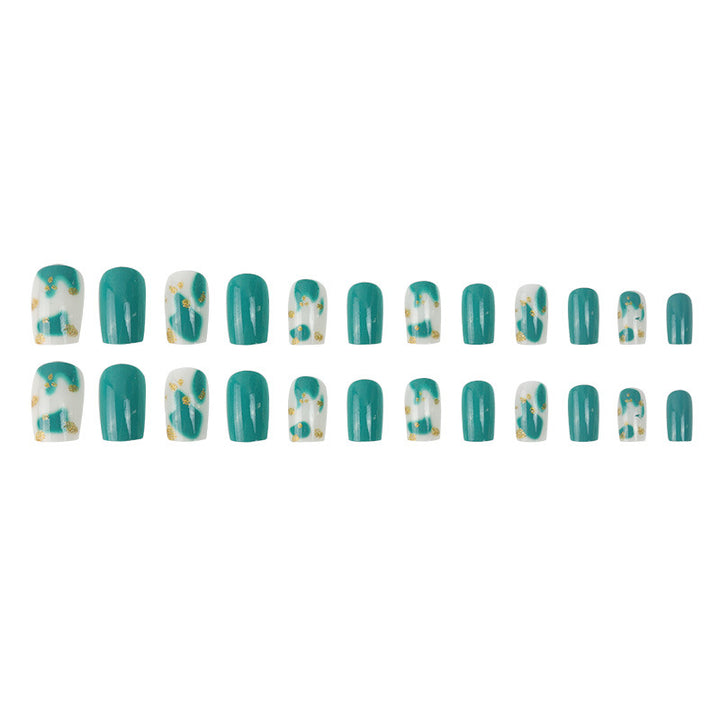 Künstlerisches Press-On-Nagelset mit floralen und goldenen Akzentdesigns Karnz