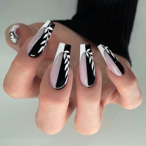 Kunstvolle Nagelverlängerungen im eleganten Schwarz-Weiß-Design Karnz
