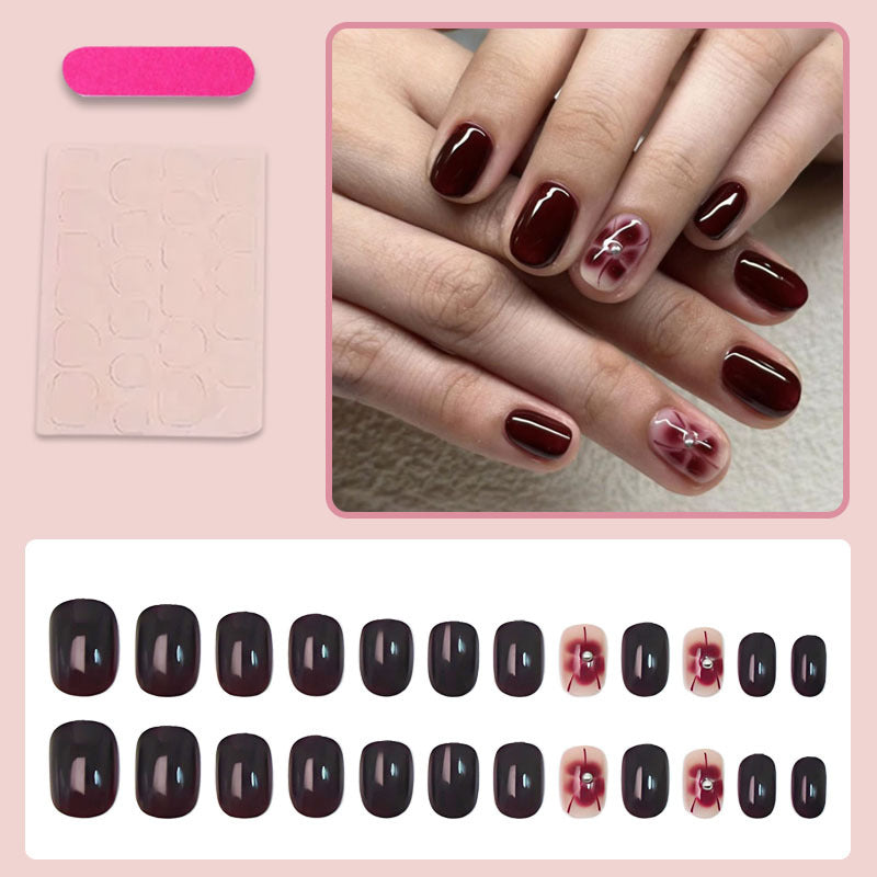 Kunstnagelset mit eleganten Blumendekoren Karnz