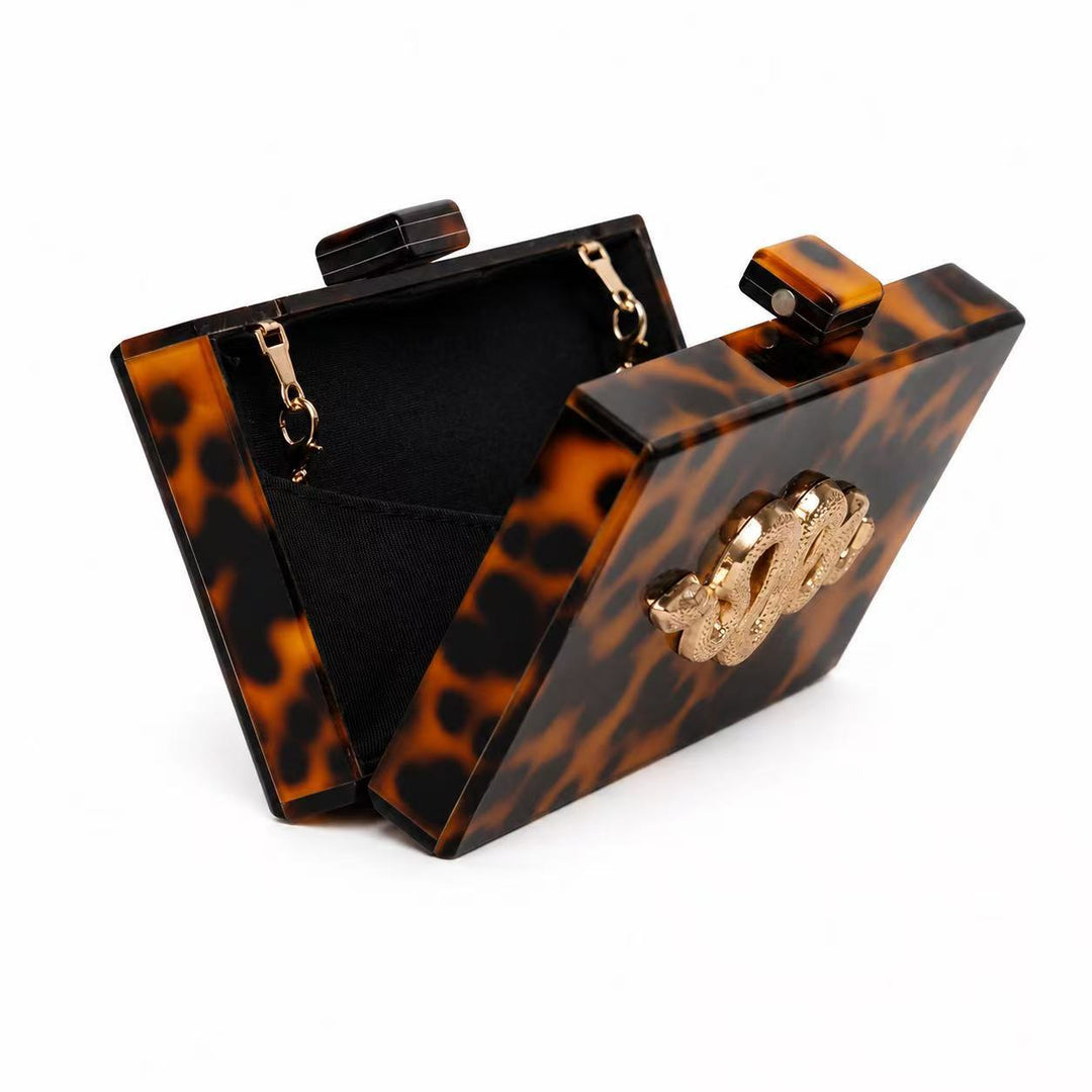 Exotische mit Schlangenverzierung aus Acryl gefertigte Clutch