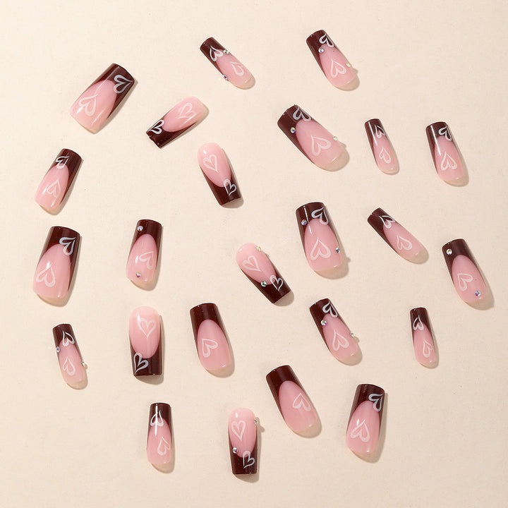 Kunstnagelset mit romantischen Herzmotiven Karnz