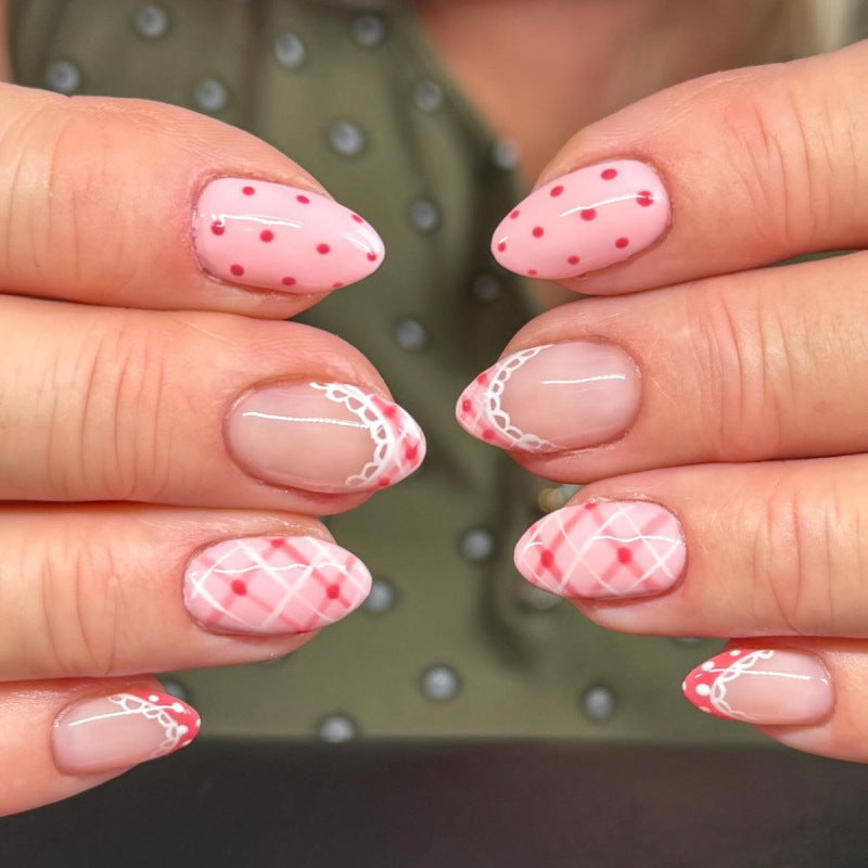 Künstliche Nagelkunst mit verspielten Punkten und Schleifen Karnz