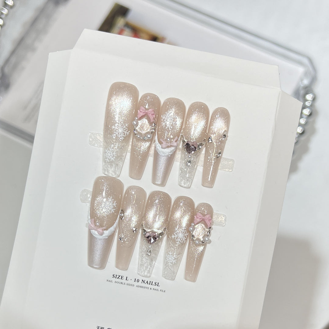 Dekorativer Stiletto Press-On Nagelset mit Strass- und Glitzerakzenten Karnz