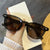 Damen modische Cat-Eye Sonnenbrille mit transparentem Rahmen Karnz
