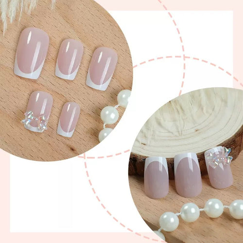 Kunstnagelset mit glamourösen French-Spitzen und funkelnden Akzenten Karnz