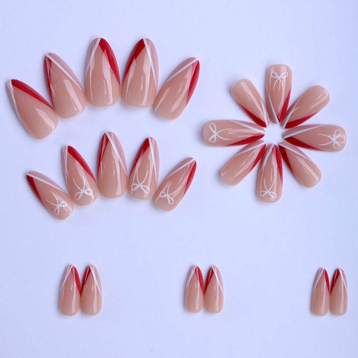 Kunstfingernägel Im Eleganten Stiletto-Design mit Schleifen-Akzenten Karnz