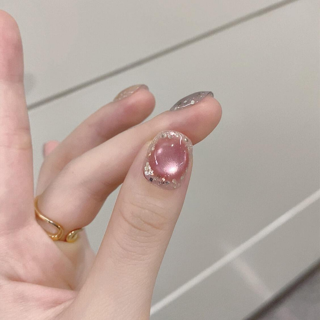 Künstliche Kunstnägel mit Schimmernden Effekten und Eleganten Glitzerakzenten Karnz