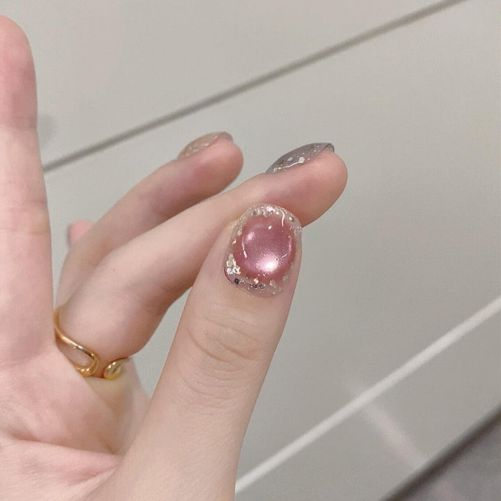 Künstliche Kunstnägel mit Schimmernden Effekten und Eleganten Glitzerakzenten Karnz
