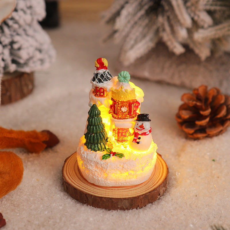 Weihnachtliche Miniaturbeleuchtung mit Schneeszenen Karnz